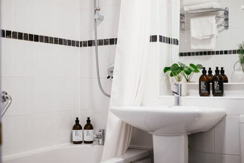 Combined shower/tub, hair dryer, towels, soap