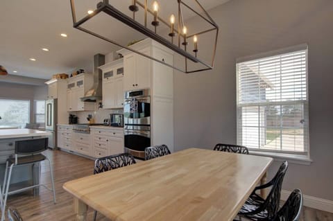 Adjacent dining table to the large kitchen