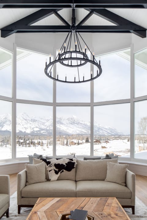 Lower level Great Room wall of windows framing the entire Teton range