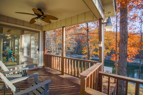 Upper level deck with sitting area and lake views