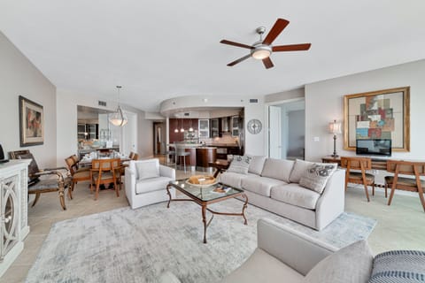 A light-filled living space with captivating views. This inviting room offers a perfect blend of comfort and style, creating a welcoming atmosphere for all.