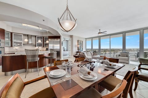 Note the carefully selected details that enhance this dining area: the textured placemats, the delicate glassware, and the subtle color palette that creates a refined aesthetic.