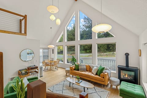 Welcome to The Chalet! Unwind on the comfortable leather sofa and velvet chairs.