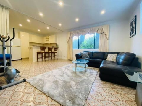 Open plan living area includes Full kitchen Breakfast bar Dining table &  Lounge