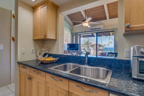 Stainless steel sink and ocean views from your kitchen