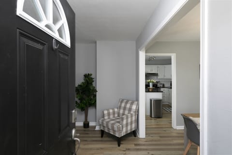 Upon entry, a glimpse of our living room and the kitchen and dining area. 