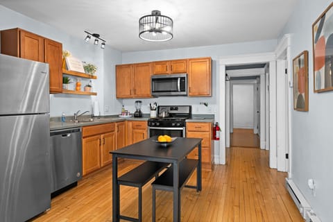 Culinary adventures await in this stylish space with modern appliances and bright decor!