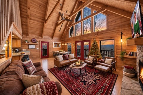 Cozy Smoky Mountain cabin with Christmas decor, a fireplace, and views.