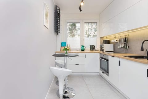 Functional kitchen with white cabinets and quality appliances that allow you to prepare home-cooked meals.