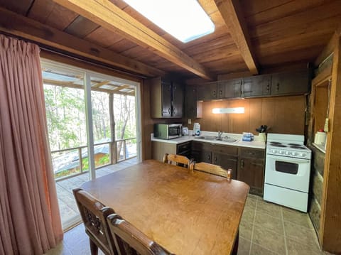Kitchen - Kitchen with appliances and dining table
