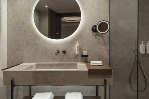 Shower, designer toiletries, hair dryer, bathrobes