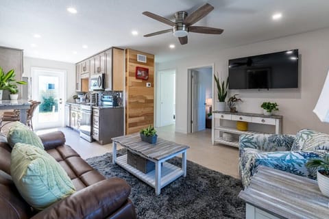 Bright living area with a modern kitchen and comfortable seating for relaxing or entertaining.
