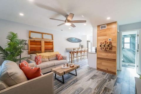 Modern living area with comfortable seating and an open kitchen layout.