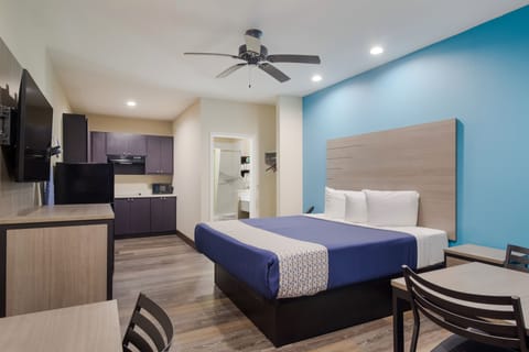 Deluxe Room, 1 King Bed, Kitchenette | Desk, laptop workspace, iron/ironing board, free WiFi