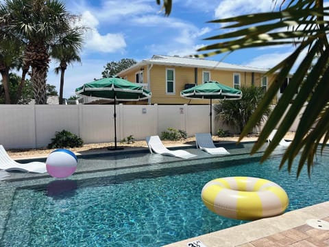The backyard/pool area is a shared space with our sister cottage, Mango!