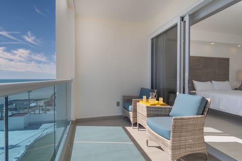 The bedroom opens onto the patio, and has seating.
