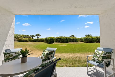 Ground floor walkout patio- steps from the beach!