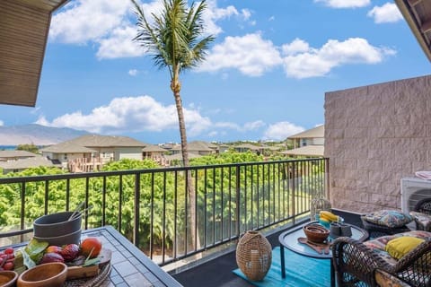 Garden-view lanai with outdoor seating, ideal for coffee or sunset relaxation.