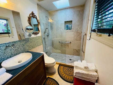 Casita bathroom with stone tiled shower