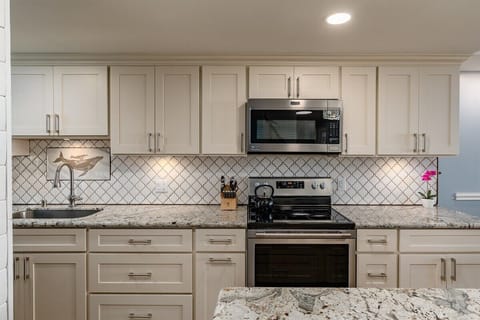 Cook with ease in our beautifully updated kitchen! New counters, cabinets, and appliances await your culinary creations.