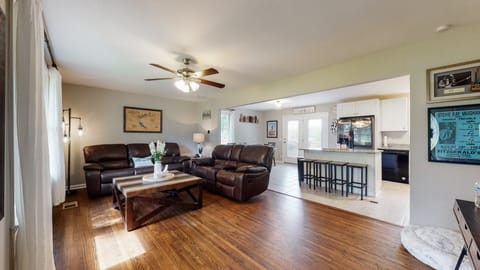 Relax on the recliners enjoying the 65in TV. Great entertaining area.