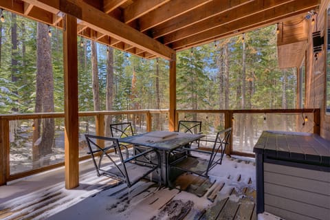 - Covered deck with forest views and patio seating  
- Snowy escape with string lights and fresh mountain air  
- Outdoor dining area perfect for cozy cabin stays