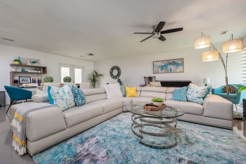 [Living Room] Open floor plan with lots of seating areas to view the 65` smart TV.