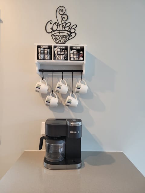 Keurig coffee pot with full size drip coffee pot on side