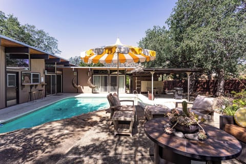 Private mid-century retreat with sauna and pool, set in a peaceful neighborhood.