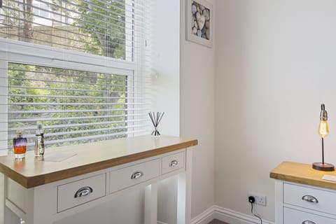 Get ready at for your day at the dressing table in the main bedroom.