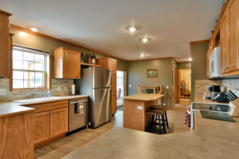 Fully stocked kitchen with all the essentials needed to cook meals.