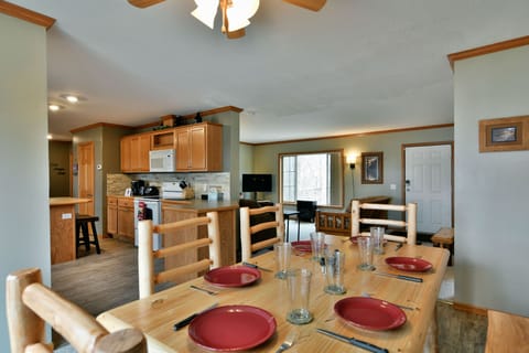 Brand new log-cabin style dining room table and chairs and dishes!