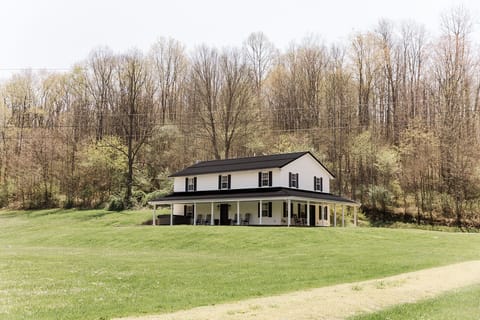 Fully covered porch with outdoor seating allows for hours of outdoor enjoyment.