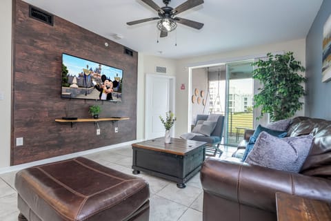 Step into this spacious, comfortable living area. The expansive room is adorned with tasteful decor, offering a blend of modern aesthetics and homey warmth. 