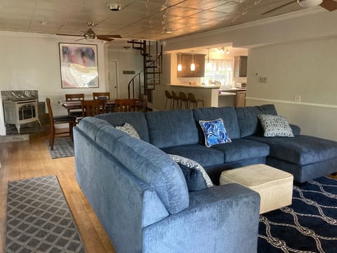 Living room and Dining Room.  Spiral staircase leads to second floor