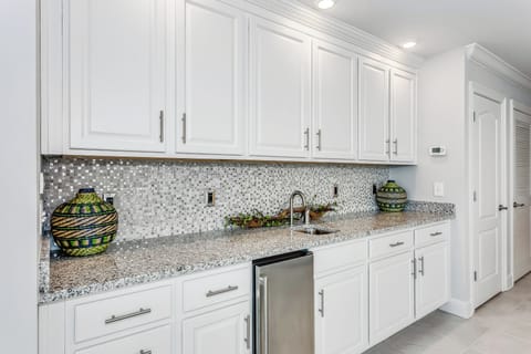 Wet bar with wine/liquor specific glassware. 