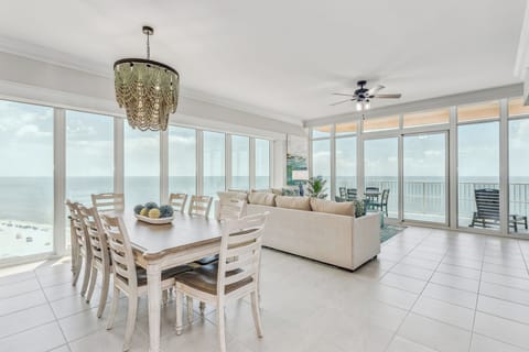 Living/Dining Room with amazing views of the Gulf. Electric blinds for privacy