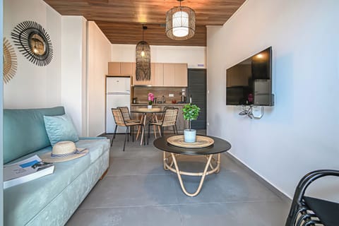 Deluxe Suite 2-Bedroom | Living area | 24-inch flat-screen TV with satellite channels, TV