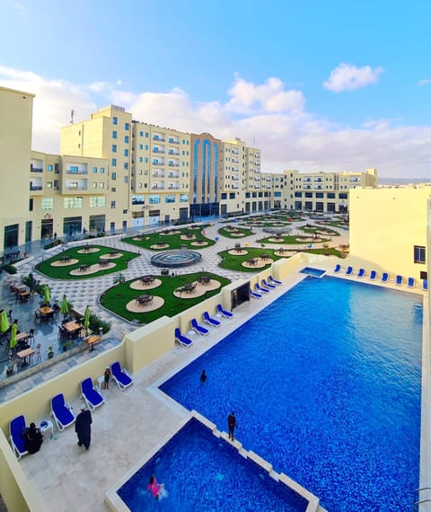 Outdoor pool, pool umbrellas, sun loungers