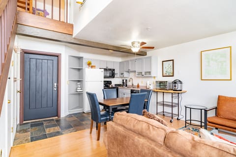 Front door is near the kitchen and dining area.