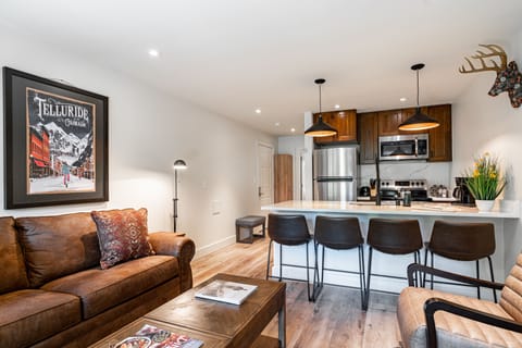 Additional barstool seating at the kitchen counter.
