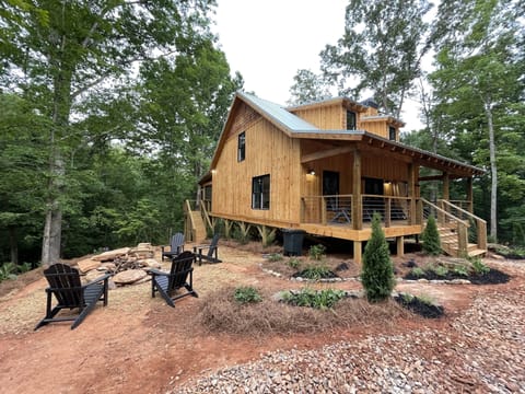 Side of cabin with fire pit