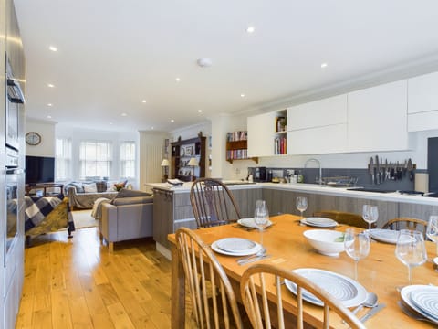 A high-spec kitchen with integrated appliances, including an induction hob and dishwasher.