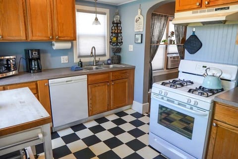 The checkerboard kitchen has everything you need: all appliances, dishes, pots/pans, utensils and all.