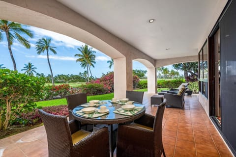 Covered lanai with dining table and loungers