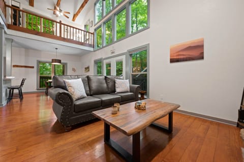 The centerpiece of Laurel Forest Retreat is the wall of windows that truly showcases the forest!