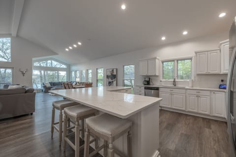 Brand new countertops and flooring grace the entirety of the fully equipped kitchen