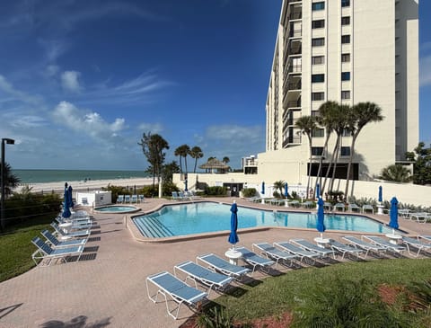 Heated beachfront pool and hot tub at the complex with plenty of - Heated beachfront pool and hot tub at the complex with plenty of lounge chairs and umbrellas.