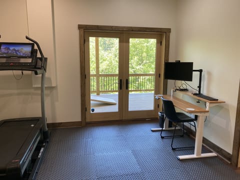 Workout room; adjustable standing desk
