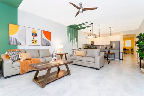 Open living space that seamlessly connects the beautiful kitchen and dining area, offering a perfect blend of comfort and style.